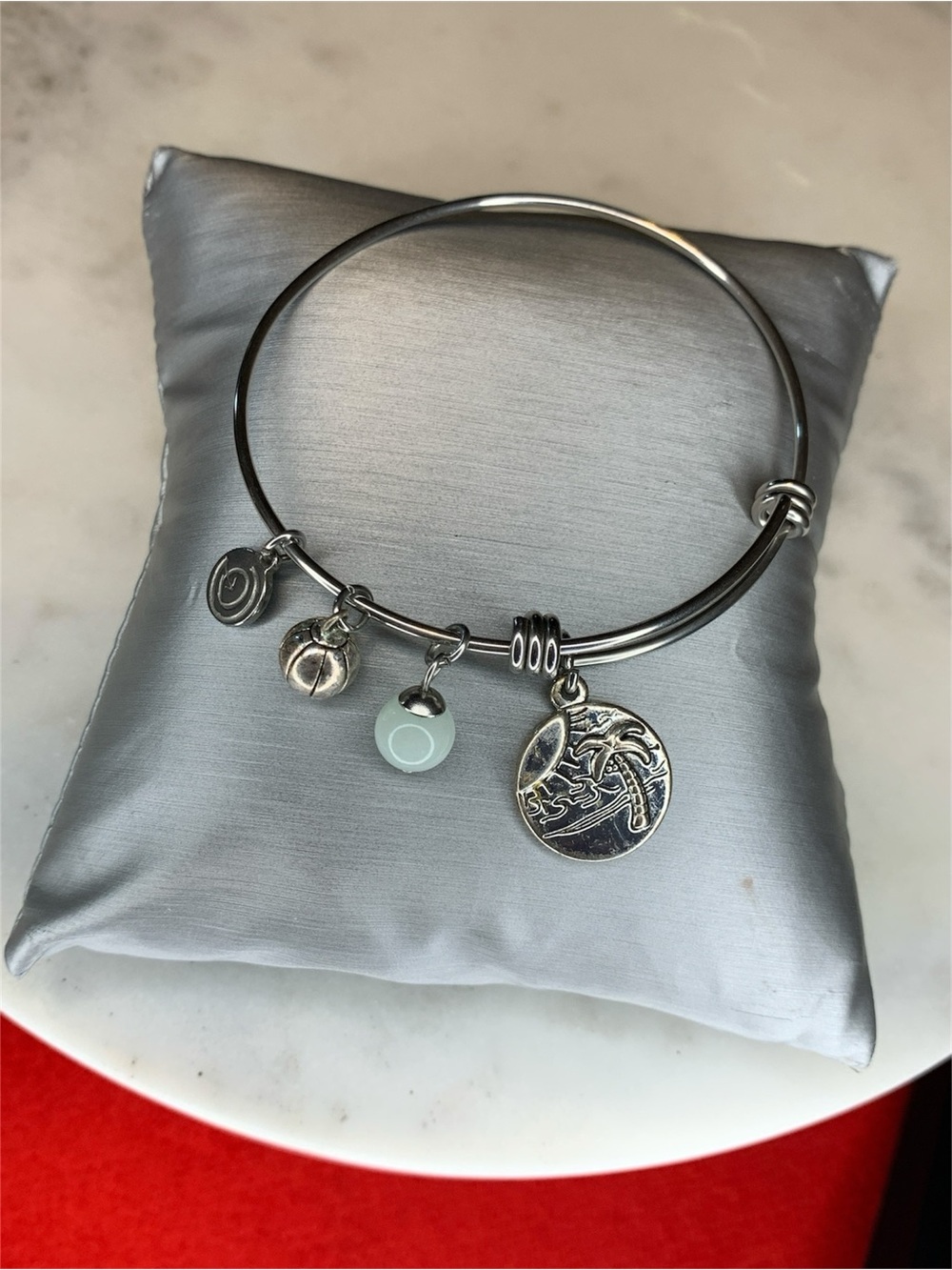 Silver Charm Bangle Bracelet with Sea Wave Disc and Light Blue Accent
